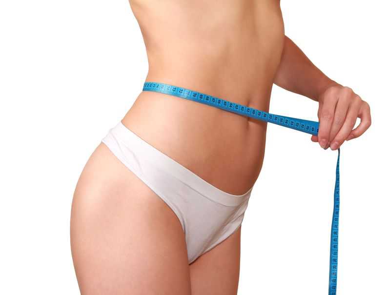16129960 - woman measuring waistline after diet perfect health slim body isolated o white background||