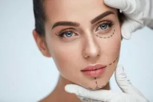 Facial Beauty Treatment. Beautiful Young Female With Smooth Skin